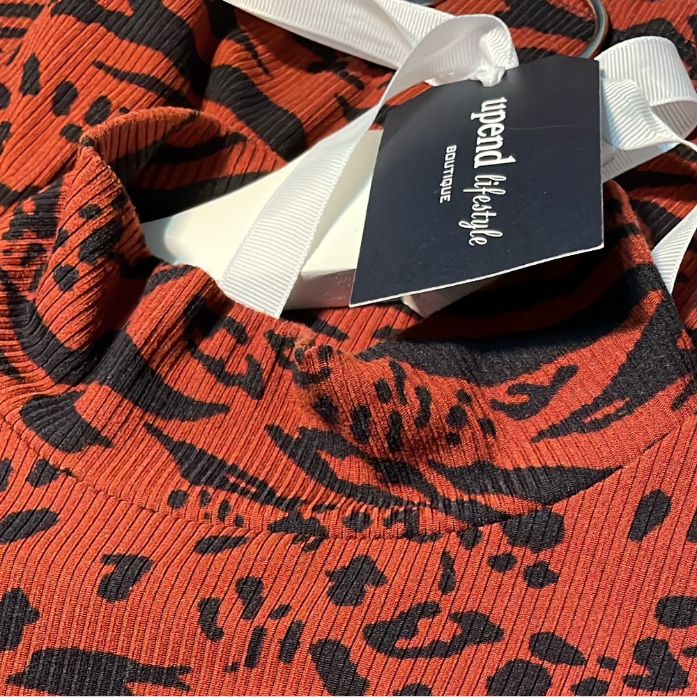 Rust/Black Animal Print. Mock Neck Top.  Long Sleeves